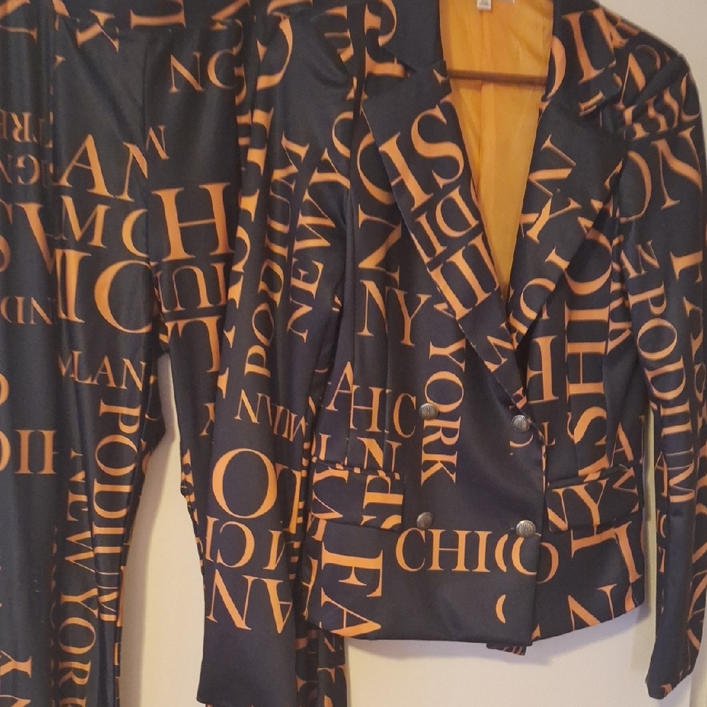 ELEGANT, ORANGE AND BLACK DOUBLE-BREASTED, WIDE LEG PANTSUIT.